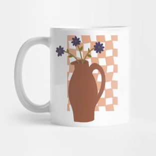 large terracotta vase with a trio of blue flowers on checkerboard background Mug